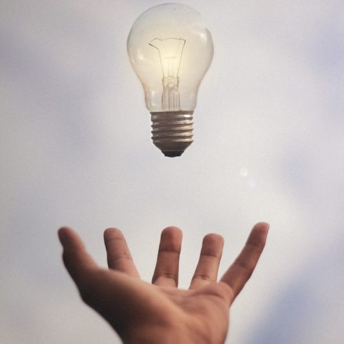 Photo by Júnior Ferreira person catching light bulb